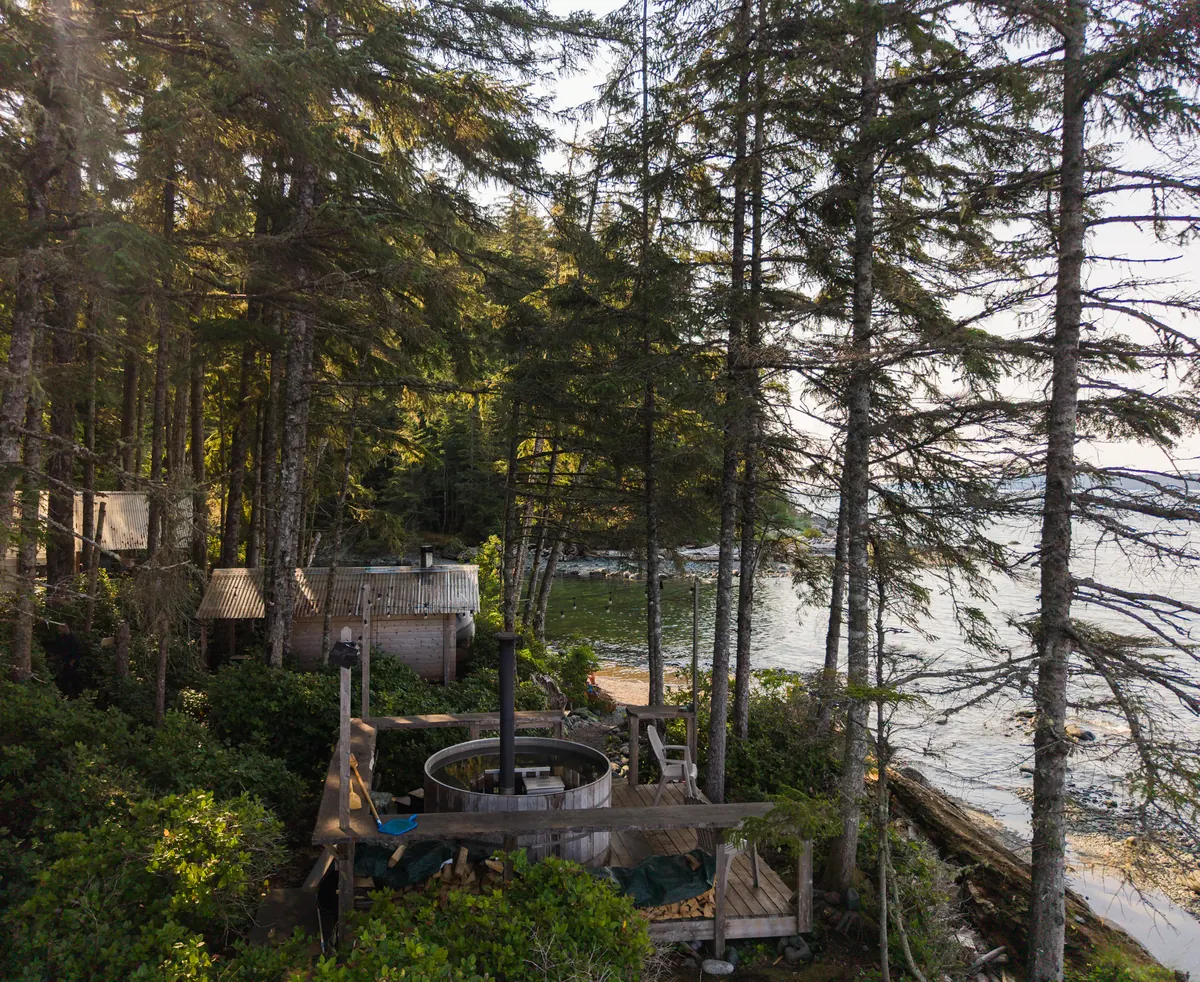From the air, Orca Camp’s cabins sit in old-growth forest on the shore of Johnstone Strait.