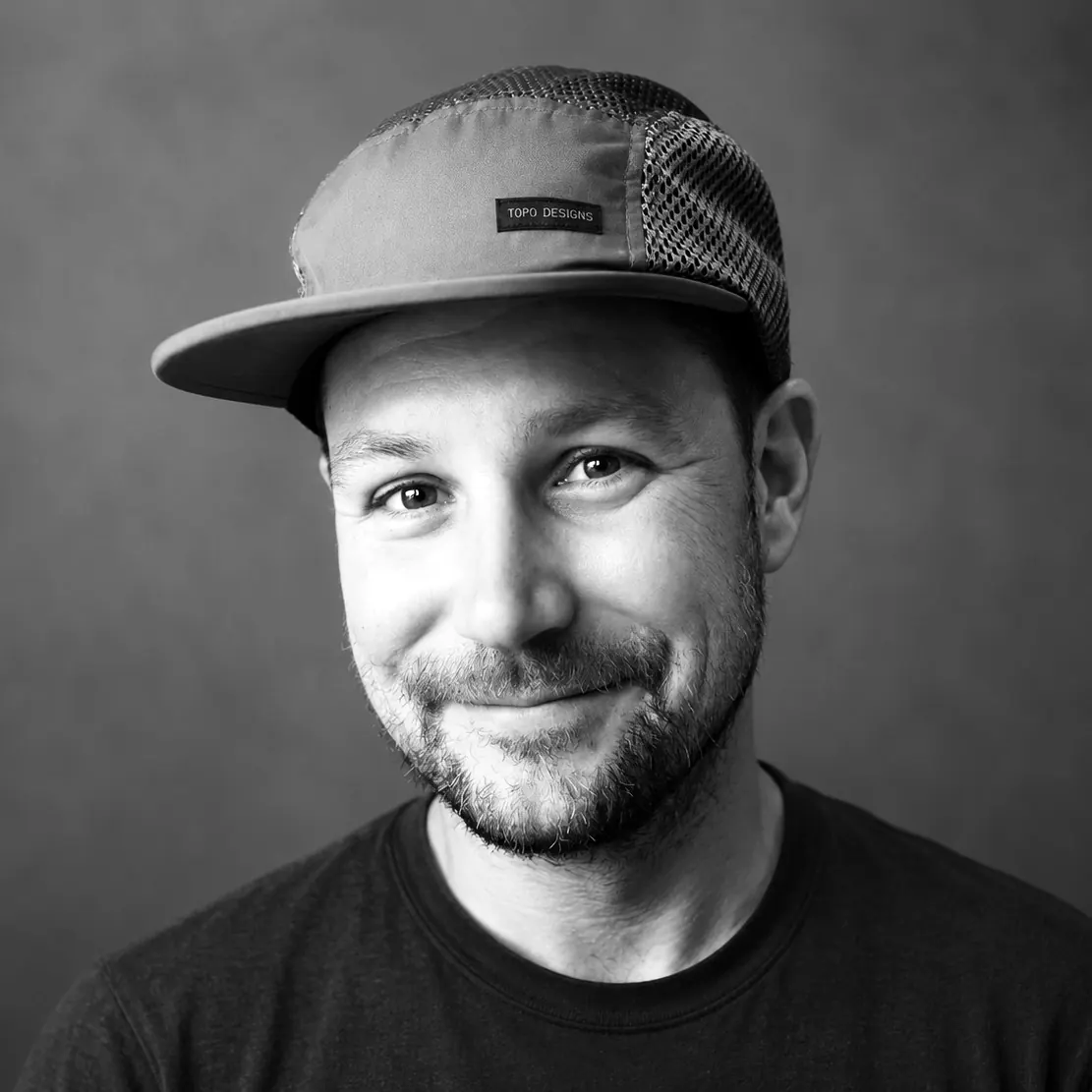 A black and white portrait of Adam Bognar.