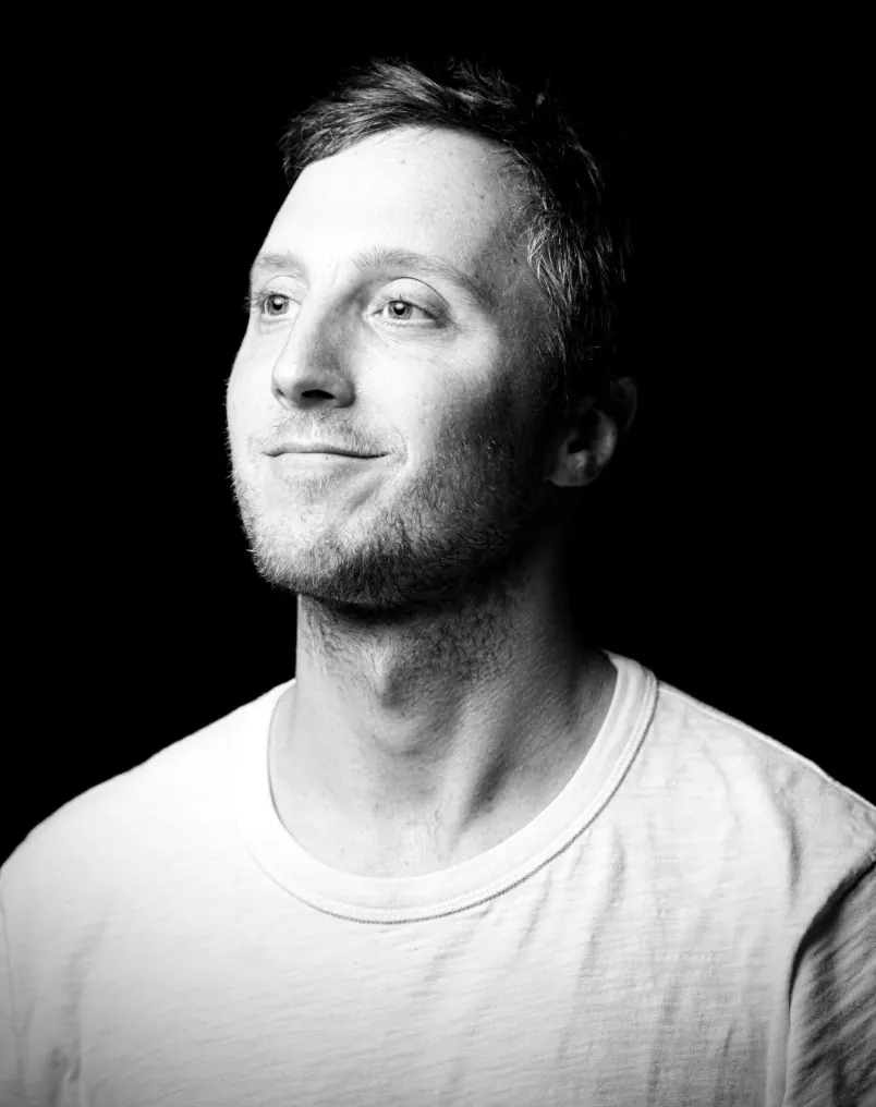 A black and white portrait of Ben Taft.